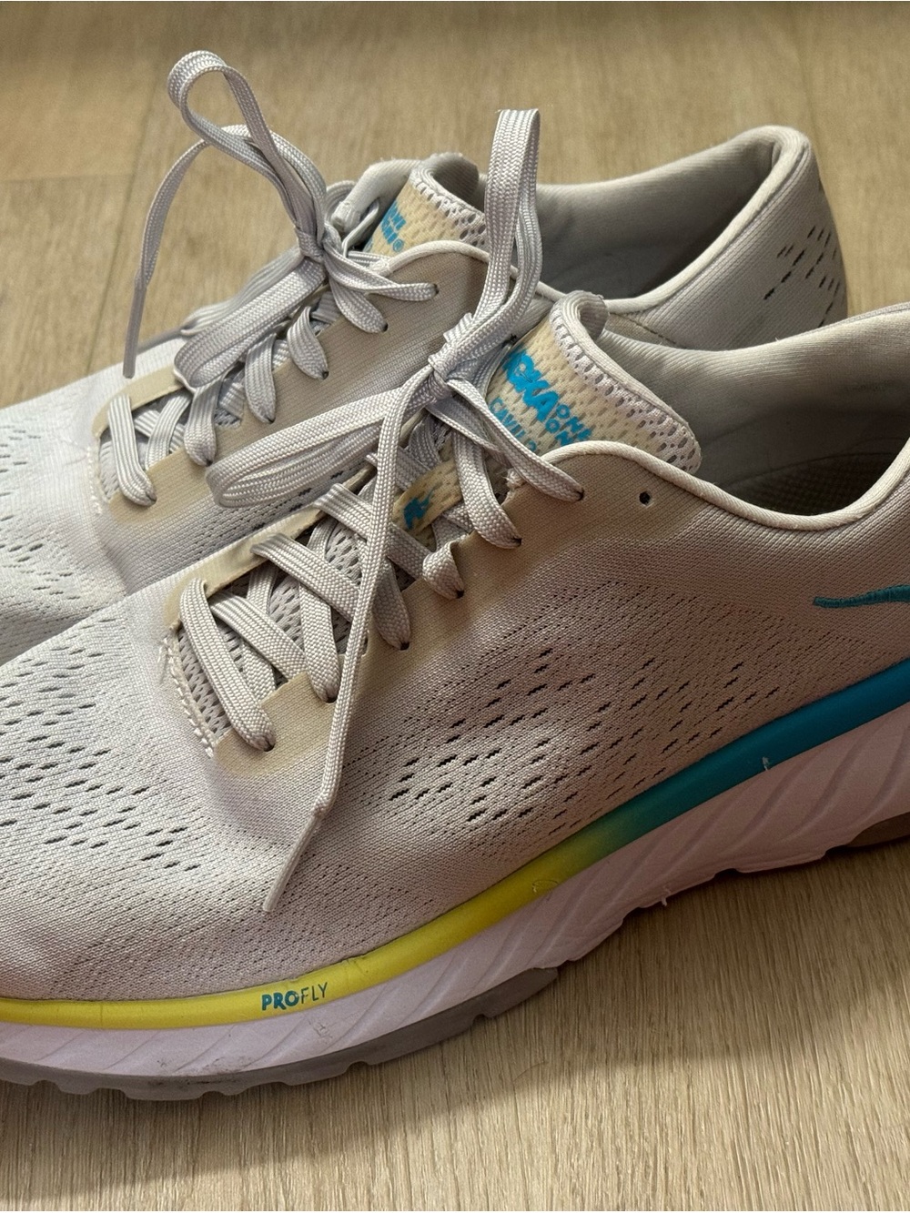 Hoka Women's Grey Running Shoes with Blue and Yellow Accents